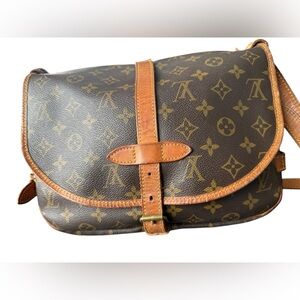 This is a Louis Vuitton Monogram Saumur 30 messenger bag